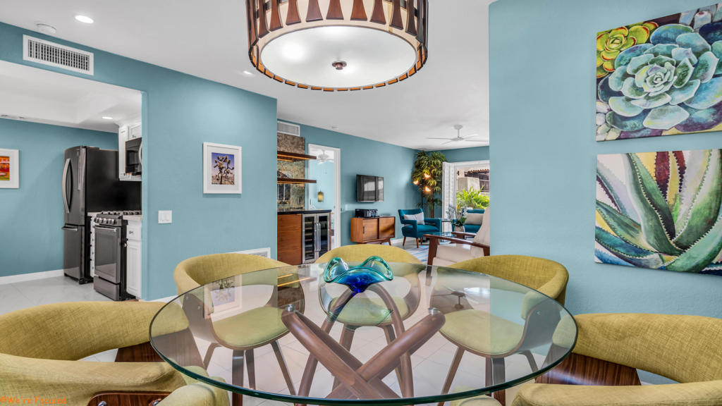 Beautifully remodeled ground-floor condo in South Palm Springs' Canyon Country Club Estados. This 2 bed, 2 bath home has been thoughtfully upgraded throughout, including a full electrical rewire, sleek tile flooring that flows through every room and out onto the patio, and a refreshed kitchen with new countertops, sink, disposal, and appliances. Both ensuite bathrooms have been fully renovated with modern finishes, including new showers, vanities, and fixtures. A brand-new built-in bar with a beverage fridge adds the perfect touch for entertaining or unwinding in style. Additional upgrades include a newer in-unit washer/dryer (2022), new HVAC system, new water heater, and updated plumbing for improved efficiency and peace of mind. Enjoy a private patio just steps from the beautifully maintained grounds, with stunning mountain views throughout the community. Residents enjoy resort-style amenities including pools, spas, tennis courts, a fitness center, and clubhouse--all just minutes from downtown Palm Springs, hiking, and golf. Whether you're looking for a full-time retreat or a weekend getaway, this move-in-ready condo offers style, comfort, and unbeatable value in South Palm Springs.