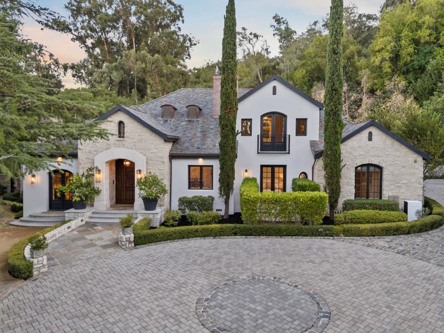 Absolutely Stunning French Contemporary Custom Designer Home in Prime Saratoga Neighborhood. Quintessential California seamless indoor-outdoor living. The luxury amenities, meticulous details and sophisticated craftsmanship throughout are apparent. Beautiful checkered marble entryway, private office, fabulous dining room with built in cabinets, concealed wine refrigerator and incredible ceiling details. Truly, too many quality features to list. Wonderful primary suite with spa like bathroom, expansive walk in closet is accessed by grand staircase. Four additional en-suite bedrooms. Gourmet Chef's kitchen is highlighted by a 60 inch Wolf range, marble countertops, SubZero refrigerator and drawers, oversized island w/ bar seating and walk-in pantry. Effortless flow to the sun drenched breakfast nook and spacious family room with 20 ft ceilings. Incredible floor-to-ceiling glass door and window piece opens to the most spectacular backyard setting imaginable. the resort style backyard has to be seen to be fully appreciated. Covered loggia, outdoor kitchen, legit pizza oven, spectacular pool with ledge waterfall, multiple entertaining and lounge areas, bocce court, putting green, play area and more. Fitness room, craft room and an incredible cinema-quality theater w/ stage and bar.