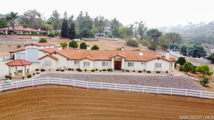 WHAT AN INCREDIBLE EQUESTRIAN PROPERTY WITH MULTIPLE PURPOSES AND A DETACHED ADU! 3 bedroom/3 bath 2436 sqft main home with a detached 1 bed/1 bath ADU that has a kitchen and laundry area. Oversized hi-bay detached garage, next to the main home, that can hold 2 cars plus a 36ft RV, with full hookups in garage. Fully landscaped pool-size backyard. At the entrance of the property to the right, there is a full size machine shop that can also hold 2-3 vehicles or other projects. There are 3 stalls for horses, a tack room, feed room and a fully lit arena for the horses. DON'T MISS YOUR CHANCE AT OWNING SUCH A VERSATILE PROPERTY! Sewer:  Septic Installed Topography: LL