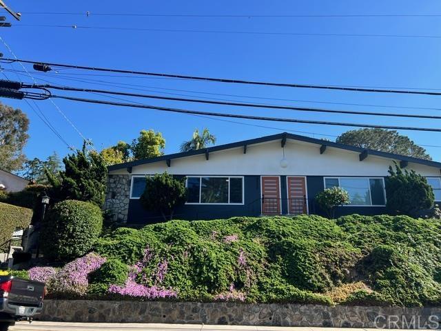 Luxury living in this fully remodeled mid-century modern house! Nestled on an elevated lot, just a 5-minute walk from La Mesa Village, this property is located in a quiet duplex with respectfull neighbors: only one shared wall. This 3-bedroom, 2-bathroom unit boasts a spacious open-concept living/kitchen area with vaulted ceilings and panoramic windows framing stunning views of the La Mesa hills. With modern amenities including forced AC/Heat, in-unit laundry (washer and dryer included), reserved 2 parking spaces, private rear patios, and meticulously landscaped grounds. Tenant to pay for water, sewer, electricity, cable, and trash. Landlord to maintain landscaping.