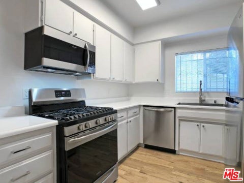 Photo of 4407 AMBROSE Avenue #106, Los Angeles, CA 90027 (MLS # 26997029)