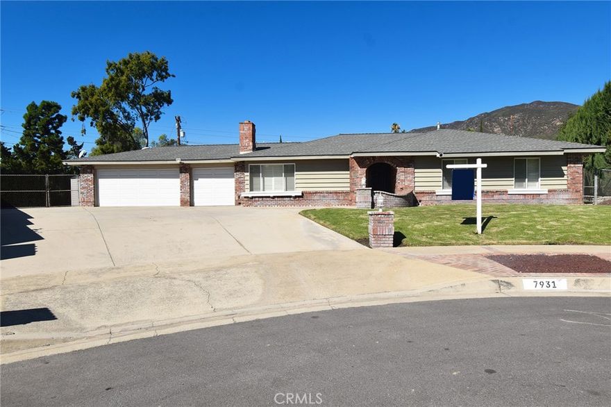 Rare Opportunity...a Spacious Home on a Large Parcel of Land! Nestled at the end of a picturesque cul-de-sac,  situated high in the foothills of Alta Loma,  this property spans over half an acre! It boasts a stunning mountain backdrop and a mostly level lot that offers a generous RV parking area with triple-wide spaces. There is more than sufficient room for several RVs, trailers, and boats...a true haven for motor enthusiasts! Furthermore, the rear of the property leads to a distinct two-car garage, which complements the three-car attached garage that provides ample additional storage space. The property holds considerable potential for accessory dwelling units (ADUs), an RV parking garage, or the expansion of this charming single-story ranch home. The entryway opens into a formal living room that features a fireplace and is accentuated by a beautiful panel and beam wood ceiling. Shutters are fitted throughout the residence, extending into the family room area that seamlessly integrates with the dining and kitchen areas. The primary en suite includes a walk-in closet and a tastefully designed bathroom. The low-maintenance backyard is adorned with citrus trees and offers a vast covered patio and a fire pit, perfect for outdoor entertaining occasions. Do not allow this remarkable investment opportunity to slip away; contact us to arrange a private showing today!