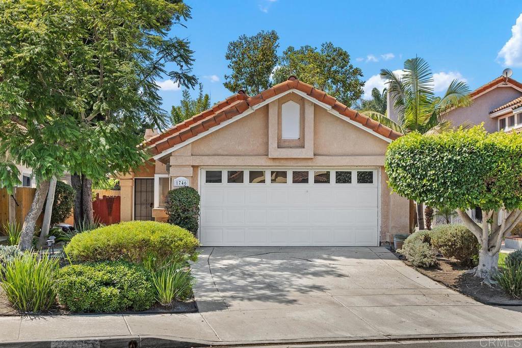 Charming Single-Story in Rancho del Oro! Welcome to this inviting single-story home, offering a spacious, shady backyard with room to grow. Step inside to a bright living room with soaring ceilings and brand-new luxury vinyl plank flooring. The kitchen is equipped with a newer stove and a brand-new microwave/hood combo, making meal prep a breeze. This home features three generously sized bedrooms and two full baths, including a primary suite with its own private en-suite. Enjoy the convenience of an attached garage, driveway parking, and easy access to the 76, 78, and 5 freeways. Shops, dining, and the beach are just minutes away — perfect for embracing the coastal lifestyle!