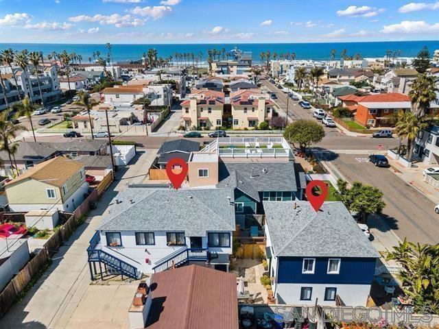 Location, Location, Location! Welcome to the most southwesterly city in the continental U.S.—just one block from the beach! This exceptional multi-family property offers coastal living at its finest, with easy access to the grand wooden pier and sweeping views of Downtown San Diego and the Coronado Islands. Perfect for an owner-occupant, Airbnb host, or traveling professionals, this property offers incredible flexibility and income potential. It features four well-maintained units: There are a total of FOUR units (2) large 2BR 1BA and (2) 1BR 1BA units PLUS FIVE deep one car garages at the property and another THREE off street parking spots. The property showcases true pride of ownership with well maintained units and tons of upgrades throughout. CONVERT the 1300 sqft of garage space into multiple ADUs easily for more value! The property also has a large laundry room, common area space, a private yard for one of the units, and extra storage. This is a rare opportunity to own a pride-of-ownership property in a highly desirable beachside location with tons of upgrades throughout. Whether you’re looking to house-hack, expand your rental portfolio, or build for multigenerational living, this property has it all.
