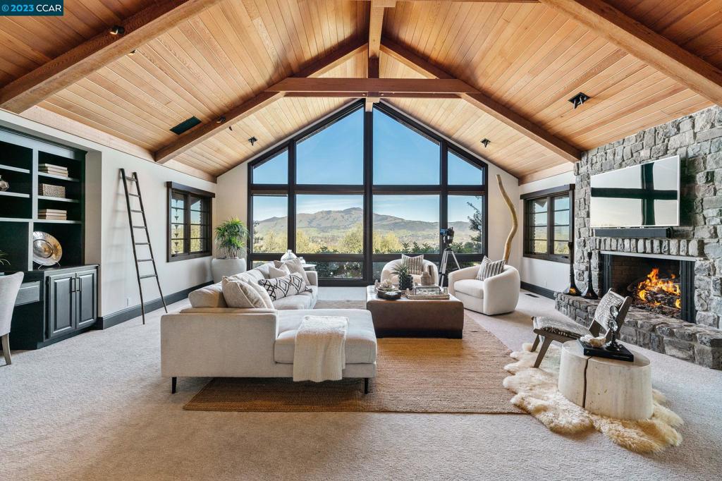 Escape to a world of rustic elegance, breathtaking views, & an unparalleled sense of peace & privacy in this 4-bed, 4.5-bath custom home. Over 6,400 sq. ft. of living space, including a guest cottage & a magnificent open-concept design, this residence is the epitome of comfort & style. Main home is approx. 5500 sq. ft. & ADU just under 1000 sq. ft. Picturesque barn that could be an additional ADU or car collectors dream garage. Indulge in stunning panoramic views of Mt. Diablo & relax in the lush serenity of fully-gated surroundings. Step inside to find a home that feels like a single-story dream, w/ formal living & dining rooms, a library, & a great room that boasts oversized windows to take in the breathtaking views. Entertain guests in the fully-covered outdoor living area, complete w/ a sparkling pool, spa, tennis/basketball court, tennis pavilion, soccer field/driving range & putting green- all of which add to the endless outdoor amenities. Over $5mm in upgrades to exterior infrastructure, highest quality landscaping, fully drivable & golf cart accessible. Elevate your California lifestyle with this sports lover's paradise, conveniently located just 1.5 miles from the vibrant downtown Danville & its abundance of dining, shopping trails, and award-winning schools.