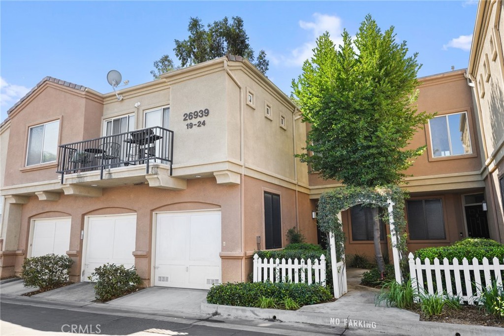 Welcome to this freshly updated townhome in a wonderful central location in the Santa Clarita Valley. With new paint, brand new laminate flooring in the main areas, and new carpet on the staircase and in the bedrooms, this home is clean, bright, and move-in ready.
The living room is filled with natural light and opens directly to a private outdoor patio—creating a nice indoor-outdoor flow that’s perfect for relaxing or entertaining. (Fireplace is decorative only).
The kitchen includes white cabinetry, tiled countertops, and a gas range—great for everyday cooking, with a layout that connects easily to the dining and living areas.
The primary bedroom features a walk-in closet and an en-suite bathroom with a dual vanity. The second bedroom is light-filled with a spacious closet and double door entry.
A washer and dryer are included, and the connected garage offers direct access plus plenty of room for storage.
The community is well maintained, with landscaped grounds, commmunity pool and spa and easy access to local parks, shopping, dining, and major freeways.
With thoughtful updates, bright living spaces, and a prime location, this home is ready for you to move in and make it your own.