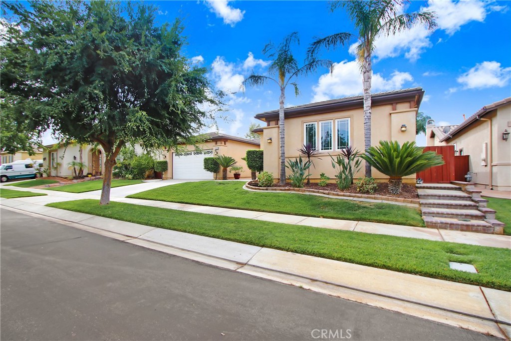 Beautiful one-story home at the most sought out gated community of Tournament Hills 1. Situated walking distance to top-rated schools. This exceptional property harmonizes classic design, thoughtful updates and flexible spaces at every stage of life. Whether you're starting a family, working from home, entertaining friends or seeking peaceful retreat, this house ready to welcome you. Entry way with paver stones as your porch area. Spacious Great Room with fireplace, carpeted, open to the Kitchen with granite countertop, updated sink, fixtures, design handle knobs and decorative backflash, tile floors. Plenty of cabinets. Next to it Formal Dining Room with modern design lights. Den that is large enough to convert to another bedroom, simply add a door and closet. The main Primary Bedroom Suite located at back of the house, French doors going to back yard with a view. Ceiling fans and updated cabinets at double sinks with marble countertop and separate mirrors, separate shower stall and bathtub. Huge walk-in closet. The other Master Bedroom near front of the house, updated cabinets and double sinks, separate shower stall and bathtub, also walk in closets. Windows around the house with shutters and blinds. Large private backyard, gardens, pavers stones. Energy efficient, smart home features dual A/C controls, water softener located at garage. EV Charger at the garage, Plenty of storage cabinets on both garages. Newly painted interior walls. Schedule a viewing today and discover the comfort and possibilities that await within this beautiful family home.