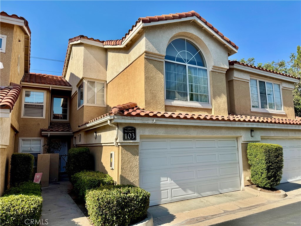 Welcome to this charming two-story townhome in the private Cortina community. Offering 1,298 sf of comfortable living space, this home features 2 bedrooms, 2.5 bathrooms, and a spacious 2-car garage. The inviting floor plan includes a bright living area with a two-story ceiling that flows seamlessly to the dining area and rear patio, perfect for relaxing or entertaining. Upstairs, the primary suite offers a generous retreat area, which can be the third bedroom, or ideal for a home office, workout space, or cozy sitting nook. Each bedroom is well-sized with ample closet space. Built in 1989, this home combines character with modern functionality. Cortina residents enjoy a private setting with fantastic community amenities, including a pool, spa, and clubhouse. Conveniently located near schools, shopping, markets, and freeway access, making daily commutes and errands a breeze. Don’t miss the opportunity to make this wonderful townhome your own!