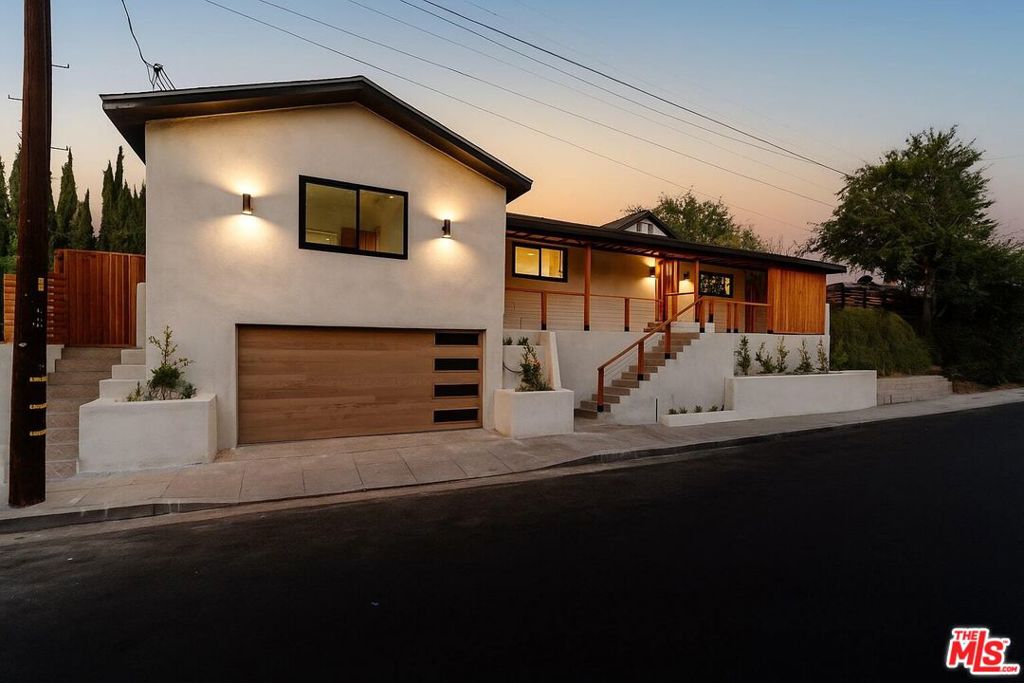 Perched atop the hills of Highland Park, this stunning home offers sweeping views and a perfect blend of modern design with thoughtful upgrades. Step inside to discover an open and airy floor plan with designer light fixtures throughout, brand new windows and doors, and a sleek bar with a wine cooler. Perfect for entertaining. The chef's kitchen is outfitted with premium Forno appliances, Taj Mahal quartzite countertops, and flows seamlessly into the living and dining areas. The primary suite boasts his-and-hers walk-in closets and a luxurious retreat feel with stunning views. Major upgrades include a new roof, new HVAC system, new tankless water heater, and an upgraded 200-amp panel, giving peace of mind for years to come. Additional highlights include a custom garage door, fresh landscaping with a fire pit, and a new fence and gate for added privacy. With its elevated corner lot location, stylish finishes, and big views, this turnkey property is truly a Highland Park gem.