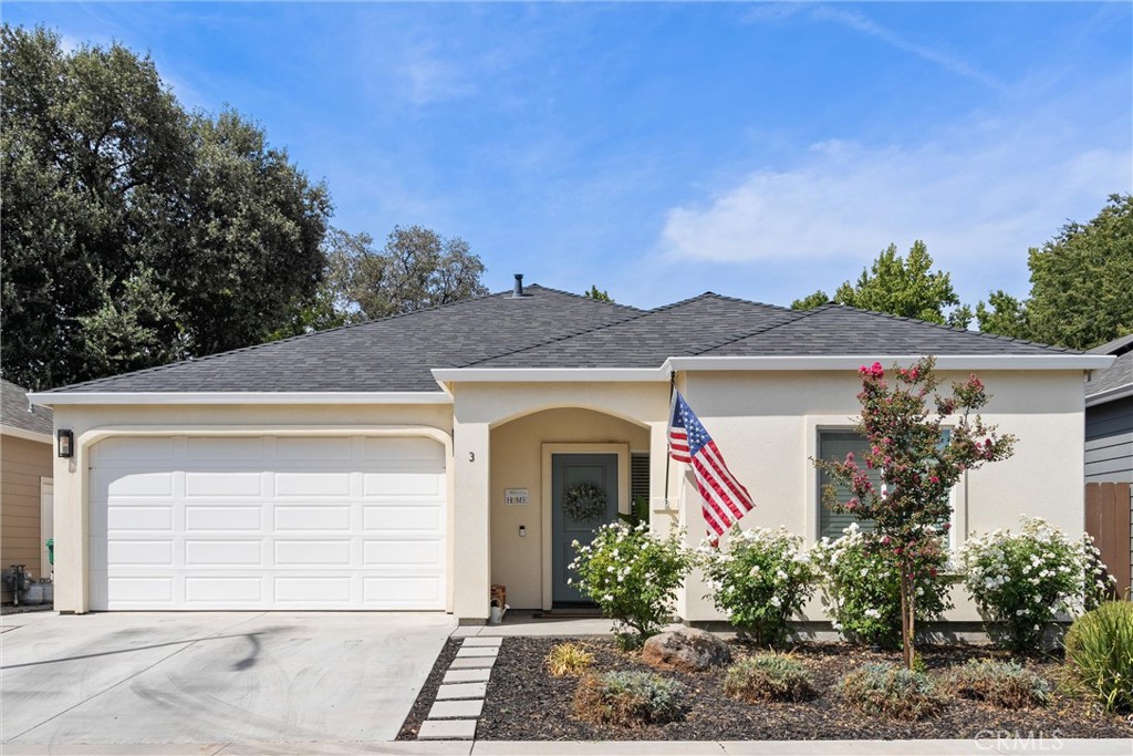 Welcome to 3 Portia Court in North Chico! Built in 2022 by a trusted local contractor, this 3-bedroom, 2-bathroom home spans 1,376 square feet and blends modern design with the warmth of a lived-in, loved space. With OWNED solar, 9-foot ceilings, and a smart floor plan, it offers comfort, efficiency, and charm from the moment you arrive. The curb appeal is undeniable—curbed streets, tidy landscaping, and a welcoming front porch lead you inside, where natural light, recessed lighting, and durable luxury vinyl plank floors set the tone. The heart of the home is the open kitchen and living space, where granite countertops, custom cabinetry, stainless steel appliances, bar-top seating, and a pantry make both everyday meals and entertaining a breeze. The dining and living areas flow seamlessly to the backyard, where the Seller has created a thoughtfully landscaped outdoor space designed to maximize enjoyment without the upkeep. Imagine relaxing on the covered patio, hosting weekend barbecues, or simply sipping your morning coffee, all without spending hours mowing or maintaining a high-maintenance yard. One of the standout features of this floor plan is the bedroom located at the front of the home. Separate from the others, it’s ideal for guests, an office, or a private retreat. Down the hall, you’ll find a second bedroom and a full guest bath with granite countertops and a shower/tub combo. The primary suite anchors the back of the home, offering a peaceful space with dual closets, ceiling fans, and an ensuite with a walk-in shower and granite counters. Practical features add to the appeal, central HVAC, a tankless water heater with circulating pump, a whole-house fan, fire sprinklers, and of course, energy-saving owned solar. 3 Portia Court isn’t just a newer build; it’s a home that’s been lovingly personalized with smart details inside and out, offering you more time to relax and enjoy the lifestyle you deserve in one of Chico’s desirable newer neighborhoods.