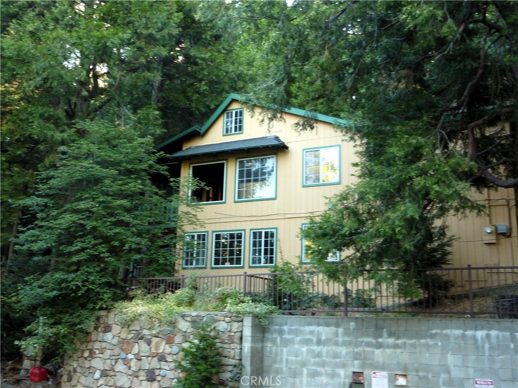 What a great opportunity for your new home, or an investor. The home has some damage from a recent fire. The interior has the drywall and flooring all removed, but the studs are still there. The information on the bedrooms and bathrooms is from the county tax assessor. The shell and foundation of the home are in good shape - the home has not been "red tagged". And, the utilities are still on and connected. What a fabulous opportunity!
The property has two separate parcel numbers, 338-223-18 and 338-223-20, and consists of 4 full lots plus part of an extra lot. Please see the assessors map for full details. The vacant land kind of wraps around the water tank.
