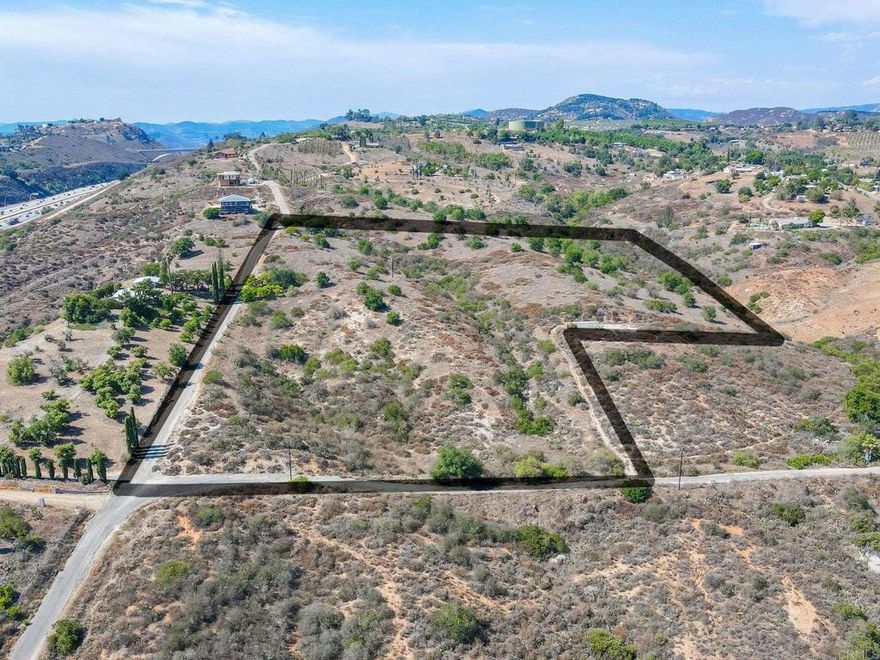 Dream, Design, & Build on 7.72 Scenic Acres! Imagine building your custom home on this peaceful, semi-rural property once thriving as an avocado grove—now ready for your vision. This expansive 7.72-acre lot offers breathtaking views, tranquility, & endless potential. With a Valley Center water meter already installed & nearby utility pole access, the essentials are in place to get started. Ideally located just minutes from I-15, shopping, dining, and schools—plus new home developments underway nearby—this location combines convenience with privacy. Zoned agriculture/semi-rural residential, the lot is perfect for your private retreat, hobby farm, or estate dream home. Don’t miss this opportunity to turn this beautiful land into your own slice of paradise in the Escondido/Bonsall area.