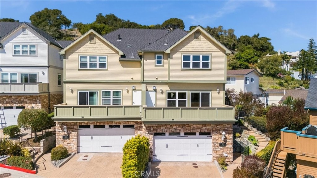 Discover refined living in a private enclave of just six homes, tucked away just a few short steps walking distance away from the heart of the charming Village of Arroyo Grande. This beautifully designed residence offers a perfect mix of sophistication, comfort, and coastal convenience.
Step into a light-filled open-concept floor plan where panoramic hillside, dune, and ocean views set the scene. The main living area features a cozy gas fireplace, custom built-ins, and a wall of windows that leads out to a serene deck ideal for evening sunsets and stargazing.
The chef's kitchen is a true standout with granite countertops, premium appliances, abundant storage, and a raised dining bar that's perfect for entertaining. A built-in wine rack and stemware display in the dining area add both charm and function.
Upstairs, two generously sized en-suite bedrooms offer privacy and comfort. The ocean-view primary suite boasts a luxurious bath with soaking tub, glass shower, dual vanities, and custom closet. The second suite also features a stylish en-suite bath and a custom California Closets system.
The lower level is a flexible bonus space with high ceilings, a full bathroom, wet bar, and built-in storage perfect for a media room, home office, guest area, or creative studio. Direct access to a finished two-car garage with epoxy floors, high ceilings, and ample built-in cabinetry completes the space.
Outside, enjoy your own peaceful garden escape. A private patio with pergola is perfect for morning coffee or relaxing evenings surrounded by lush landscaping.
Additional features include a full laundry room with built-ins and folding counters, central heat, and easy freeway access. Live just minutes from local shops, dining, beaches, and wine country.
Lease this unique property and experience elevated Central Coast living.