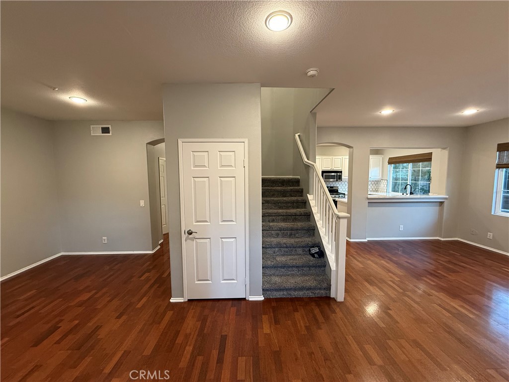 Tucked within the prestigious gated Sheridan Community of West Irvine, this beautifully 3-bed + 2.5-bath end-unit townhome offers 1,574 sq ft of thoughtfully designed living space. This highly sought-after floor plan features a bright and spacious living room with abundant natural light, a cozy fireplace, and elegant French doors that open to a private backyard with no back neighbor—perfect for outdoor relaxation or entertaining guests.
The remodeled kitchen featuring sleek quartz countertops, designer backsplash, stainless steel appliances, a breakfast bar, ample cabinet space, and a built-in computer niche. Just off the kitchen, the formal dining area offers an inviting setting for family meals and special gatherings.
Upstairs, all three bedrooms provide comfort and privacy. The primary suite includes an en-suite bathroom, while a full hallway bath serves the additional bedrooms. A downstairs powder room and inside laundry room enhance everyday convenience, with direct access to the attached two-car garage. Additional highlights include plantation shutters throughout. Best of all, this home is just steps to the community pool, spa, playground, and park with BBQ areas—perfect for enjoying sunny California days. Located within the award-winning Orchard Hills and Beckman High School districts, and just minutes from the Tustin Marketplace, Orchard Hills Shopping Center, the 5 Freeway, and Toll Roads.