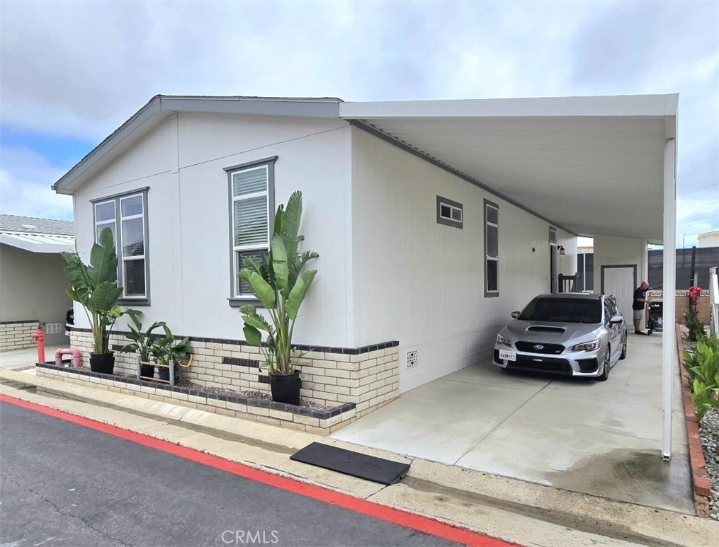 Newer 2018 Beach house!!! Across the street from the OCEAN!!! This Awesome house is in the lovely, “Huntington by the Sea” gated community, look no more! Walk to the beach in 3 minutes!!! Gorgeous open floor plan, with giant living and dining room and kitchen!!! This beautiful home is over 1,248 sqft. 2 master bedrooms and to full 2 bathrooms. This home is light and bright and includes stainless Refrigerator, dishwasher, Washer and dryer with separate laundry room. Carport attached to the home for parking 2 cars. Guest parking is also available. An upper deck can be built over the carport to have amazing views from your home. The monthly park lease is only $3,677.00 a month which includes access to the newly upgraded community clubhouse, dog park, pool, hot tub, game room and full gym all located in the park’s private gated community with private security patrol. Located down the street from the famous Huntington Beach Pier and the new "Pacific City" with new shops and restaurants. 1-year full home warranty!!!