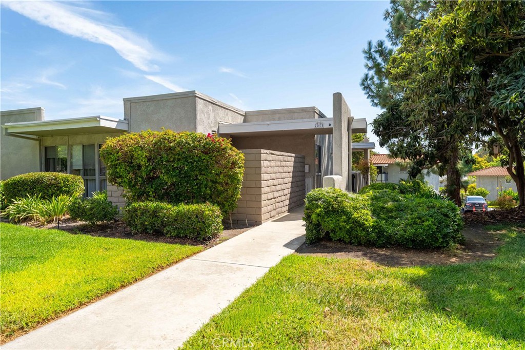 Prime Interior Location w/NO Steps + Ultra Clean Move-In Condition + Fantastic Price = VERY HAPPY BUYER!!! This single level Monterey end unit in Laguna Woods features easy access w/no steps from your assigned carport. You'll love coming home every day and entering your large private covered patio with large storage closet. You will love the open-flowing floor plan that features contemporary laminate flooring, crown molding, big newer windows. The kitchen offers quartz counters, loads of cabinetry and pantry space, and brand newer stainless steel appliances. The formal dining room has plenty of room for your nice furnishings. Both bedrooms are large. One boast mirrored closet doors wonderful windows w/private open space views. The bathroom features new modern fixtures and has the perfect walk-in shower design. There is an awesome location, professionally maintained grass lawn and plenty of available guest parking right outside from your front door. This is the ultimate 55+ adult community and lifestyle w/27 hole golf course, 9 hole executive par 3 course, 5 pools, 7 clubhouses, an equestrian center, multiple world-class craft workshops, and over 200 different social clubs. Residents enjoy free shuttle service to major amenities and markets throughout the City. No stairs or elevators at this home!