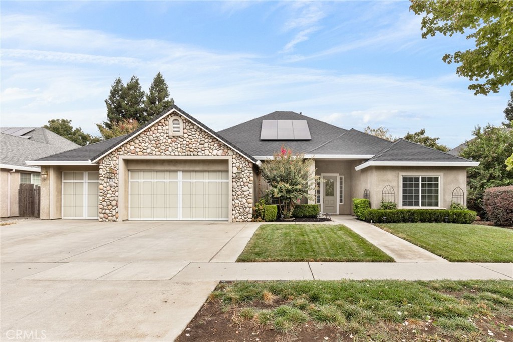 Location, location, location! Tucked away in one of North Chico’s most sought-after neighborhoods, this home blends comfort with modern style. Inside, you’ll find gleaming hardwood floors, soft neutral tones, and walls of windows that fill the space with natural light. The inviting living room is anchored by a cozy fireplace, making it the perfect place to gather. The kitchen is designed for both everyday living and entertaining. It features warm wood cabinetry, granite counters, stainless steel appliances, a gas range, walk-in pantry, and a breakfast bar that’s perfect for quick meals. Just off the entry, the formal dining room offers the ideal setting for holiday dinners and family celebrations. Your primary suite is a private retreat with plenty of space, a walk-in closet, and a spa-like bath complete with dual sinks, soaking tub, and walk-in shower. Three additional bedrooms, an indoor laundry room with sink and storage, and a 3-car garage provide all the function you could need. Added bonuses include recessed lighting, ceiling fans throughout, and owned solar to help cut energy costs. Step outside to your beautifully landscaped backyard, complete with a spacious patio for barbecues, green lawn for pets, and raised garden beds ready for your favorite plants. In a neighborhood known for its charm and convenience, this home truly checks every box. Don’t miss your chance to make it yours!