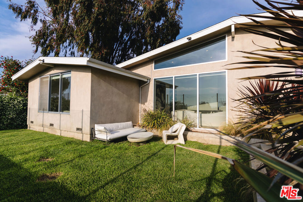 Fully remodeled in 2016, this stunning 5-bedroom, 4.5-bathroom home in prime Sherman Oaks blends modern luxury with smart living. Flooded with natural light, the open-concept layout features soaring high ceilings, a spacious living room, and an entertainer's dream kitchen with top-of-the-line appliances, sleek cabinetry, and designer finishes. The backyard offers the perfect space for relaxing or hosting, complete with lush landscaping and room to entertain. Packed with high-end amenities, this smart home includes a full HVAC system, integrated security cameras with facial recognition, smart lighting, and a cutting-edge automation system for seamless living. Located on a quiet street in a highly desirable neighborhood, this turnkey home delivers comfort, style, and next-level convenience. View endless sunsets in your large master suite which has a walk-in closet and spa-like bath featuring dual sinks, soaker tub and steam shower. Centrally located in the hills of Sherman Oaks with easy access to all of LA's top attractions. Walk into the backyard and drift away in the endless mountain views! Located in the Roscomare School district.