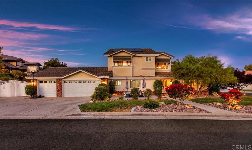 Affectionately known as “The Yellow House on the Corner,” this Spring Valley Lake gem offers ample space, scenic views, and a backyard designed for California living. Situated on a corner lot with mature trees and pristine landscaping, this 4-bedroom, 3-bath home spans 2,780 sqft on a 9,281 sqft lot with a 3-car garage, paid-off solar, and a double swing gated driveway for additional parking. Owned and loved by the same family for the past 27 years, the home blends original charm with thoughtful updates throughout. In 2022, the primary and second bathrooms were beautifully remodeled, luxury vinyl plank flooring was installed throughout, and the fireplace received a modern refresh. The first level features multiple living and dining areas, a full bedroom and bathroom, and large windows that fill the home with natural light. Upstairs, the spacious primary suite feels like a retreat with its private balcony overlooking the golf course and a spa-inspired ensuite bath. The bathroom was designed with both luxury and function in mind, featuring dual vanities, a soaking tub, a beautifully tiled walk-in shower, and abundant natural light. The backyard is a true highlight with a saltwater pool and waterfall, a BBQ area for outdoor dining, and a built-in putting green. Whether you're entertaining, lounging, or simply enjoying the warm desert evenings, this space offers a perfect balance of relaxation and fun. Additional upgrades include a new HVAC system with dual-zone thermostats and updated ductwork in 2019, along with new garage doors and openers installed in 2020. Owned solar panels, added in 2022, help keep energy costs low throughout the year. Located within the Spring Valley Lake community, residents enjoy access to lakeside parks, fishing areas, and 24/7 security patrol. Optional membership to the Bear Valley Country Club includes golf, a pool, gym, and more. With thoughtful upgrades, a flexible layout, and a backyard that truly delivers, this is the kind of home that’s ready to be enjoyed inside and out.