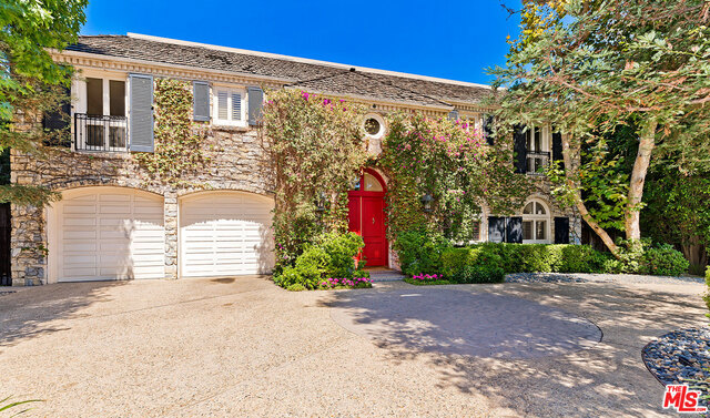 Classic elegance meets a Beverly Hills legacy. Set in the desirable East End of the Beverly Hills Flats and moments from Rodeo Drive, this Neo-Classical Traditional has never been on the market before. Privacy gates lead to a courtyard and semi-circular driveway, hidden from the street. A grand 2-story foyer greets you with a dramatic skylight and curved staircase. Over 6,962 sq. ft. with formal public spaces flow out to multiple terraces and a pool. Upstairs, there are four bedroom suites, including the master suite with vaulted and beamed ceilings, fireplace, dual baths and dressing areas and balcony. A 2-car garage and a maid's room complete the home. Built in 1988, the home has retained its original character, yet still boasts the clean lines that are sure to inspire a new owner wishing to put his or her own stamp on a property in prime Beverly Hills.