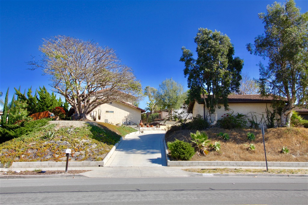 Nice big 4 bedroom 2 bath home in Vista on a 12,000 square foot lot. The home sits above the street with a private driveway. The home has solar installed. Mountain views from the upstairs enclosed Patio. Laminate flooring downstairs. Completely fenced upper yard with a patio area in the back yard. Nice area within walking distance to Vista Sports Park, local shopping and Sprinter. The property is 15 minutes from the Beach and 5 minutes from down town Vista. Neighborhoods: VISTA Other Fees: 0 Sewer: Sewer Connected Topography: GSL