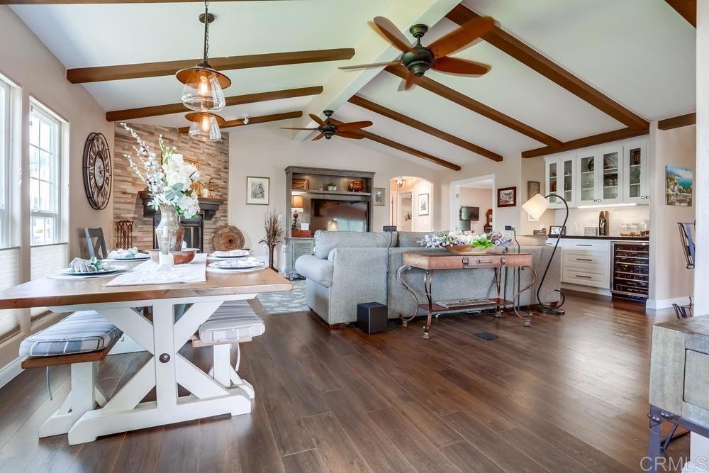This lakefront home has it all!! Multiple French doors open wide to invite the cool ocean breezes, creating a seamless connection between indoor comfort and the refreshing outdoors. This open-concept floor plan offers an effortless flow, anchored by a stunning kitchen, featuring custom soft-closing cabinets, a sleek tile backsplash, black granite countertops, lazy-Susan, and pull-out drawers in pantry. Under cabinet lighting adds ambiance, while the expansive island is perfect for gatherings. The living area has vaulted ceilings and is warmed by a corner custom-tiled fireplace, a built-in bar area with glass cabinetry and built-in wine cooler, with a black granite countertop, tying the two areas together seamlessly. Crown molding adds a touch of elegance throughout. Durable vinyl flooring ensures style and practicality. Multiple skylights provide natural light and an open airy feeling. Oversized bedrooms with walk-in closets, direct-access bathrooms with exquisite tile work and plantation shutters in multiple rooms bring a touch of luxury to daily living. With thoughtful upgrades throughout, abundant storage, and timeless finishes, this home is designed for both relaxed coastal living and easy entertaining. Perfect harmony of style, comfort and location. This home is a Must see!!! Ceiling fans throughout Dual-paned windows for comfort and efficiency Laundry room with utility sink, washer/dryer, and refrigerator. French doors and Barn style doors throughout. Wrap around deck with cover porch and ample seating Extra wide stairs and landing at the back door Beautiful rose and garden area Stunning lake views Drip irrigation system Oversized storage Shed with cupboard and shelving Live in the Resort Lifestyle Year-round. Located in Laguna Vista Estates, a five-star 55+ community, offering: Weekly social events and community gatherings, movie nights, holiday celebrations and group activities. Amenities include a pool, spa, pickleball courts, shuffleboard, clubhouse, billiards, and a ceramics studio! Approximately 4 miles from the beach, with biking trails nearby, this is the perfect opportunity to enjoy luxury, relaxation and an unbeatable coastal lifestyle in this 55+ Senior Community!