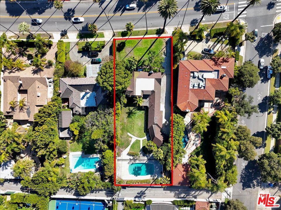 Exquisite Beverly Hills Flats Estate 5 Bedrooms (Incl. Maid's Quarters) * 3 Baths. Nestled in the coveted Flats of Beverly Hills this residence blends spacious family living, exceptional amenities, and top-tier schools in one rare offering. Oversized living/family room featuring expansive windows that flood the space with natural light and offer seamless indoor/outdoor flow. Spacious formal and casual dining rooms, with sliding glass doors opening directly onto the LUSH BACKYARD ideal for effortless entertaining and everyday family life. Nearly ***HALF AN ACRE*** of flat, manicured grounds with a grassy lawn, mature plantings, and abundant room for kids to play and guests to gather. ****SPARKLING SWIMMING POOL**** surrounded by open terrace spaces for lounging and alfresco dining. A long, wide driveway takes multiple vehicles with ease perfect for hosting and accommodating family and friends. This property falls within the Beverly Hills Unified School District. Expansive grassy backyard with pool. Long driveway for multiple cars. Located on one of the westend Flats' most coveted roads and moments to the best of Beverly Hills and the Westside, this is the perfect place to call "home". It is walking distance to many restaurants & shops. Easy access to Rodeo Drive, Cedars Sinai Hospital, UCLA, Santa Monica, Brentwood, freeways, shopping, dining, mall, theaters, Hollywood.