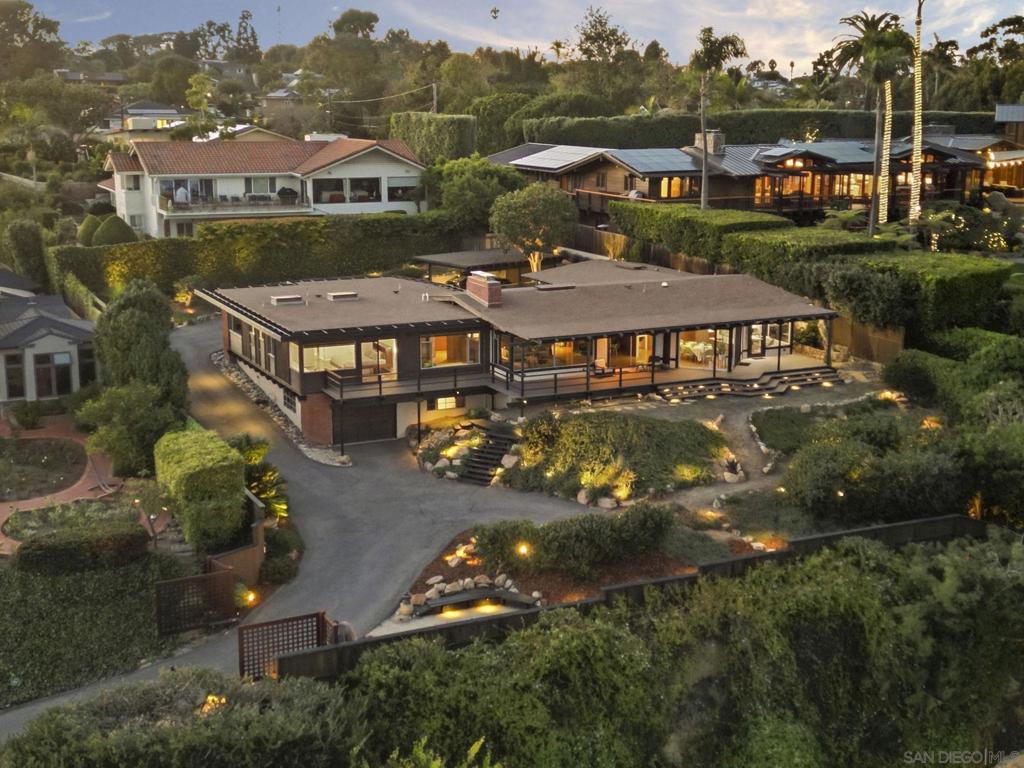 Exquisite mid-century modern home with hypnotic views across the bay and Pacific to Downtown, Coronado and the Channel Islands, is a masterwork of timeless style married with contemporary living. Gracefully sited at the pinnacle of a premier Point Loma cul-de-sac, the home sublimely integrates with its natural surroundings and maximizes the beauty and movement of the extraordinary views. Expansive windows and sliding glass doors, a blend of textures and shape, and perfected elements of Japanese and zen design inform the home’s authentic reimagining. Interior spaces maximize natural light and encourage both socialization and quiet respite. Exterior decks offer both extended entertaining space or privacy. This meticulous and thoughtfully-created home is a testament to the highest standard of mid-century modern design.