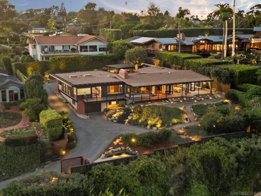 Exquisite mid-century modern home with hypnotic views across the bay and Pacific to Downtown, Coronado and the Channel Islands, is a masterwork of timeless style married with contemporary living. Gracefully sited at the pinnacle of a premier Point Loma cul-de-sac, the home sublimely integrates with its natural surroundings and maximizes the beauty and movement of the extraordinary views. Expansive windows and sliding glass doors, a blend of textures and shape, and perfected elements of Japanese and zen design inform the home’s authentic reimagining. Interior spaces maximize natural light and encourage both socialization and quiet respite. Exterior decks offer both extended entertaining space or privacy. This meticulous and thoughtfully-created home is a testament to the highest standard of mid-century modern design.