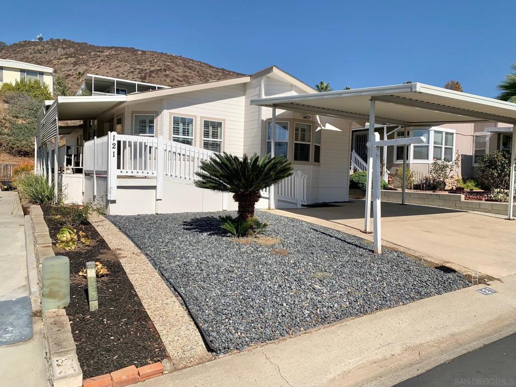 BEAUTIFUL PEPPERWOOD ESTATES 2 BEDROOM 2 BATH SINGLE STORY WITH BONUS ROOM COULD BE 3RD BEDROOM OR GREAT OFFICE 1534 SF OF LIVING SPACE HANDICAP FRIENDLY WITH WIDE RAMP ON ONE SIDE AND WHEELCHAIR LIFT ON THE OTHER COVERED PARKING FOR 2 CARS CONCRETE ALL AROUND GREAT SHED INCLUDED 55 PLUS COMUNITE SPACE RENT $1,350 .THE COMMUNITY BOASTS R/V PARKING POOL CLUBHOUSE LIBRARY FITNESS CENTER . INSIDE CENTRAL AIR AND HEAT FIREPLACE VAULTED CEILINGS CEILING FANS SPACIOUS KITCHEN WITH ALL APPLIANCES INCLUDED. INDOOR LAUNDRY ROOM MASTER BEDROOM WITH ROMAN TUB AND SEPARATE SHOWER SECURITE SCREEN DOORS HARDWOOD FLOORS KITCHEN ISLAND FORMAL DINING ROOM AND EAT IN KITCHEN 2 PATIOS