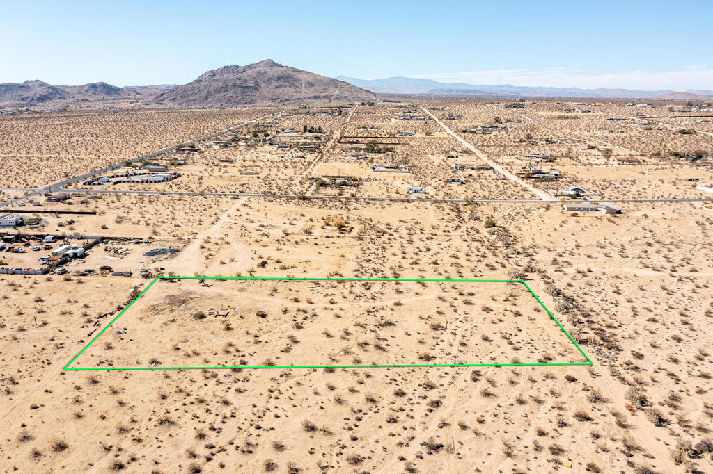 2.49 acres in the centrally located Hidden River neighborhood of world famous Joshua Tree. Property appears to have water & road easement. The 92252 zip code is quickly becoming a luxury enclave. More celebrities, musicians & artists are now calling JT home than ever before. Views of Mt. Bartlett, Bunker Mtn, Mt. Nebo, & the vast Copper Mtns. Horse property. Starry nights. Flat & usable. Ideal for a designer compound. 10 miles to Joshua Tree National Monument which sees about 3 million tourists annually. Very hot vacation rental area. Not far from the trendy JT Village with organic restaurants, cafes, the farmers market, & JT Saloon. Enjoy off-road adventures in the nearby Joshua Tree Lake Bed. Watch top music artists live at the legendary venue, Pappy & Harriets, nearby in Pioneertown. Copper Mtn College is 11 miles. 39 miles to Palm Springs. 132 miles to Los Angeles. Buyers must contact the county of San Bernardino planning department with all questions on building & uses. Buyers must contact the utilities agencies with questions & verifications of utilities. Address is a real address. Don't Wait! - Call Now! APN:0605-212-04-0000