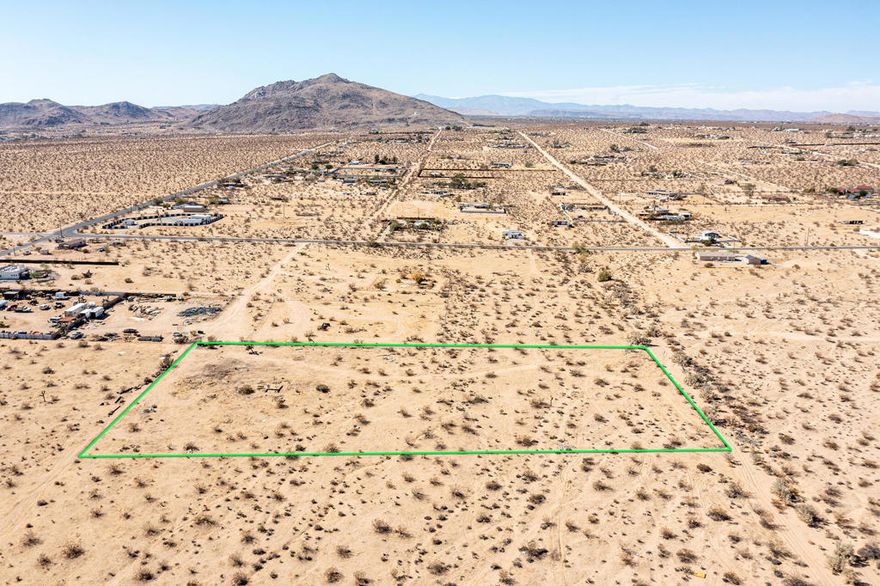 2.49 acres in the centrally located Hidden River neighborhood of world famous Joshua Tree. Property appears to have water & road easement. The 92252 zip code is quickly becoming a luxury enclave. More celebrities, musicians & artists are now calling JT home than ever before. Views of Mt. Bartlett, Bunker Mtn, Mt. Nebo, & the vast Copper Mtns. Horse property. Starry nights. Flat & usable. Ideal for a designer compound. 10 miles to Joshua Tree National Monument which sees about 3 million tourists annually. Very hot vacation rental area. Not far from the trendy JT Village with organic restaurants, cafes, the farmers market, & JT Saloon. Enjoy off-road adventures in the nearby Joshua Tree Lake Bed. Watch top music artists live at the legendary venue, Pappy & Harriets, nearby in Pioneertown. Copper Mtn College is 11 miles. 39 miles to Palm Springs. 132 miles to Los Angeles. Buyers must contact the county of San Bernardino planning department with all questions on building & uses. Buyers must contact the utilities agencies with questions & verifications of utilities. Address is a real address. Don't Wait! - Call Now! APN:0605-212-04-0000