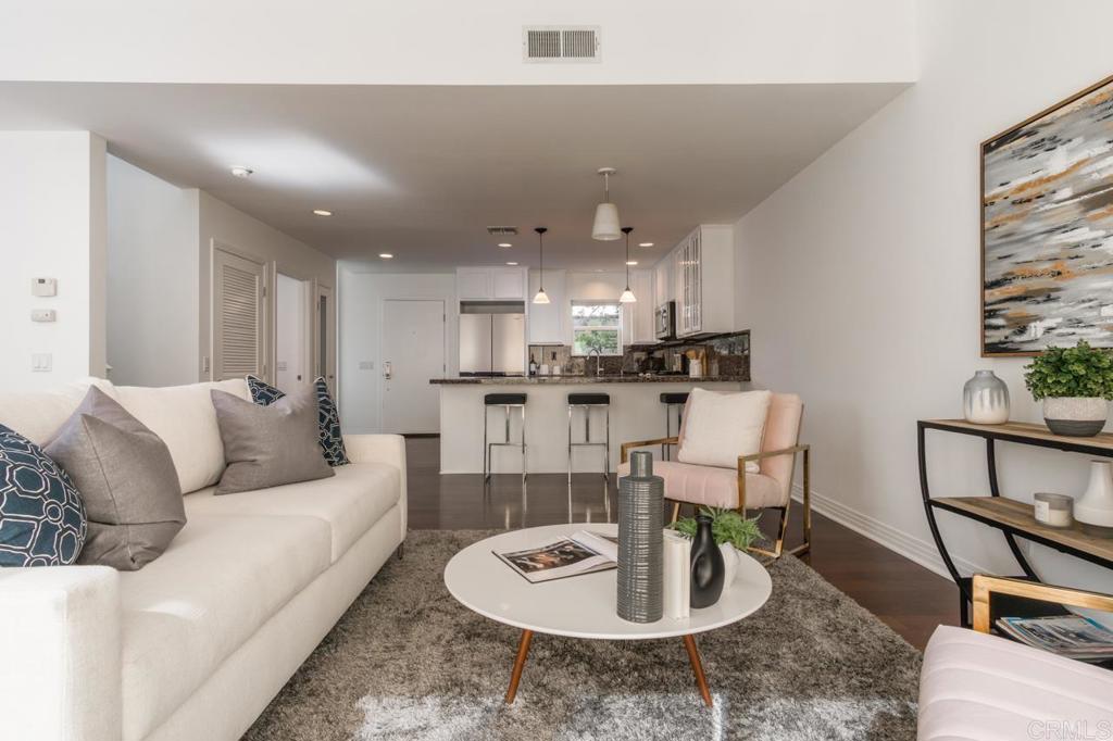 Welcome to this beautifully updated 3-bedroom, 2.5 bathroom townhome in highly desirable Toluca Woods area. Offering the perfect blend of comfort, style, and convenience in one of LA’s most desirable neighborhoods, this bright and airy home features an open-concept living and dining area with high ceilings, rich hardwood floors, and abundant natural light. The updated kitchen boasts sleek countertops, stainless steel appliances, and ample cabinet space — ideal for everyday living and entertaining. The spacious primary suite offers a peaceful retreat with a private en-suite bath and generous closet space. Two additional bedrooms provide flexibility for a home office, guest space, or growing family. Enjoy private outdoor space perfect for morning coffee or evening relaxation. The home also includes in-unit laundry, central HVAC, and direct access to a private 2-car garage. Located just minutes from local cafes, restaurants, shopping, parks, and top-rated schools, with easy access to major freeways and transit. This move-in ready gem won't last long — come see it today and make it your own!
