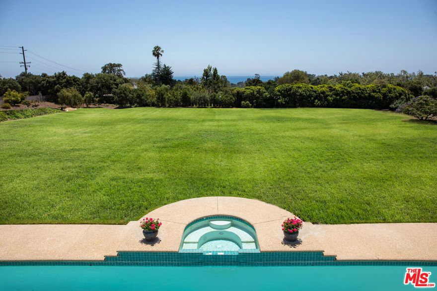 Indulge in the vast ocean and mountain views at this beautiful Mediterranean estate. Timeless architecture pairs beautifully with fresh interiors to create a modern adventure in traditional living. Nestled in a private enclave just a short distance from Padaro Beach, Summerland, and Montecito, this 4.5-acre property boasts flat grounds and captivating vistas. The main house is bright and airy, featuring generous entertaining spaces and gracious bedroom suites. Outside, a pool and spa, a charming 1-bedroom guest house, and a tennis court and batting cage offer endless options for fun. The vast grounds, along with nearby trails, make this an ideal setting for equestrian enthusiasts and animal lovers. Raised beds and two chicken coops let you customize your own personal farmer's market!