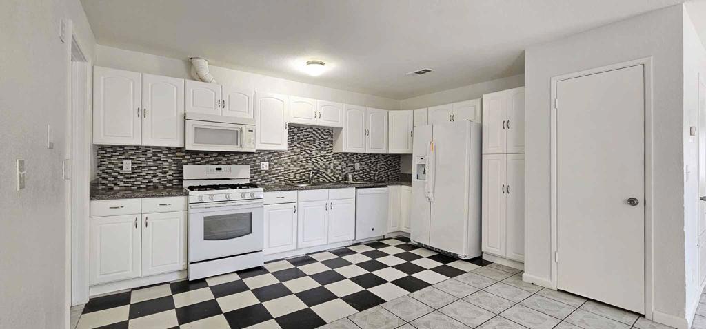 Great Rental Opportunity - 2 Bedroom Home + Detached Studio!This unique rental offers flexible living with two separate units on one lot. The front unit features 2 bedrooms and 2 full bathrooms with an open floor plan, plenty of natural light, and a spacious layout. The back unit is a detached studio with its own private bathroom--ideal for guests, extended family, or a home office.Both units share access to a large backyard, perfect for outdoor enjoyment. Conveniently located near grocery stores, schools, and everyday amenities.A rare opportunity for comfortable and versatile living in a prime location!