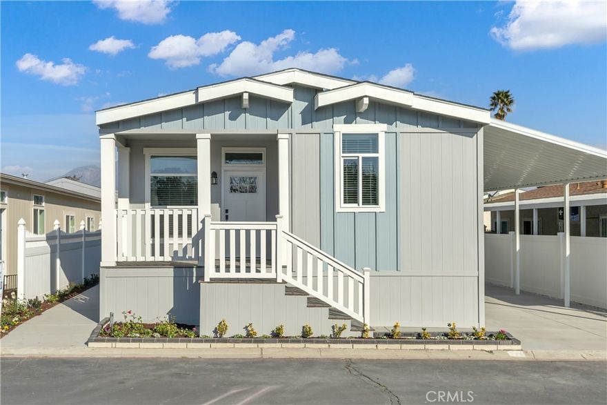 Welcome to this beautifully crafted manufactured home located in a welcoming all-age community in Ontario, CA. From the charming front porch—perfect for relaxing outdoors—to the open floor plan that seamlessly connects the living, dining, and kitchen areas, every detail invites you in.



The kitchen features a central quartz topped island, stainless steel appliances, and plenty of space for both everyday cooking and entertaining. You'll find two guest bedrooms with ceiling fans and ample closet space, a full guest bathroom with a tub/shower combo, and a private master suite with its own en-suite bathroom for added comfort and convenience.



Whether you're starting fresh or looking to settle into something thoughtfully designed, this home offers a stylish and functional living experience. Enjoy easy access to nearby shopping centers, dining, and freeway connections—a perfect blend of comfort and convenience.