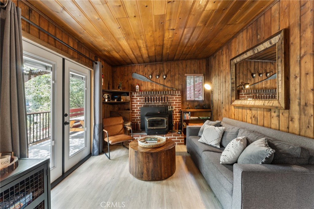 Welcome to your dream mountain getaway, nestled in the highly sought-after Moonridge area of Big Bear, California. This cozy 2-bedroom, 1-bathroom cabin offers 660 sq. ft. of charming living space on a generous 7,000 sq. ft. lot. Just five minutes from Bear Mountain and eight minutes from Snow Summit, you’ll be perfectly situated for all your alpine adventures.
Located minutes from shopping and dining, this home offers one of the best locations in Big Bear. The property has been thoughtfully upgraded with a new sub-panel, fresh paint, and stylish laminate floors. The best part? This cabin comes fully furnished and ready to welcome new owners or guests, making it ideal for those looking to enter Big Bear.
Once already registered with the County of San Bernardino, the transition to a short term rental should be easy. Investors and families alike will appreciate the ease and convenience of this move-in-ready property.
Included with the sale are engineering plans, approved by the County of San Bernardino, for a large deck that extends the patio over the property. Perfect for entertaining or simply soaking in the tranquility.
This property offers unparalleled privacy, surrounded by nature and perched on the mountainside. Experience the peace and quiet of Moonridge, where the hustle and bustle of city life feels worlds away. All info deemed reliable but not guaranteed.