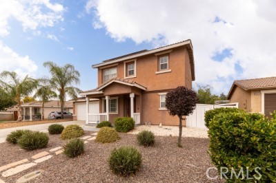 Welcome to 15475 Brasa Lane. Located in the desirable Moreno Valley Ranch community, this cozy 3-bedroom, 3-bathroom home offers a clean and bright atmosphere that will immediately make you feel at home. Situated on a spacious lot, this property features a large backyard with drought-tolerant landscaping, and a large concrete are perfect for family get togethers, BBQs & bonfires. As an added bonus the home comes with PAID SOLAR and two TESLA power walls significantly reducing electricity costs. Home is equipped with a NEMA plug to accommodate a Level 2 EV charger. Inside you'll find laminate wood flooring & tile throughout for easy cleaning and maintenance. Enjoy access to resort-style community amenities including pool, spa, and fitness center. The HOA also organizes fun activities throughout the year. Located near schools, shopping, hospital, and freeway access, this move-in ready home offers comfort, space, and convenience.