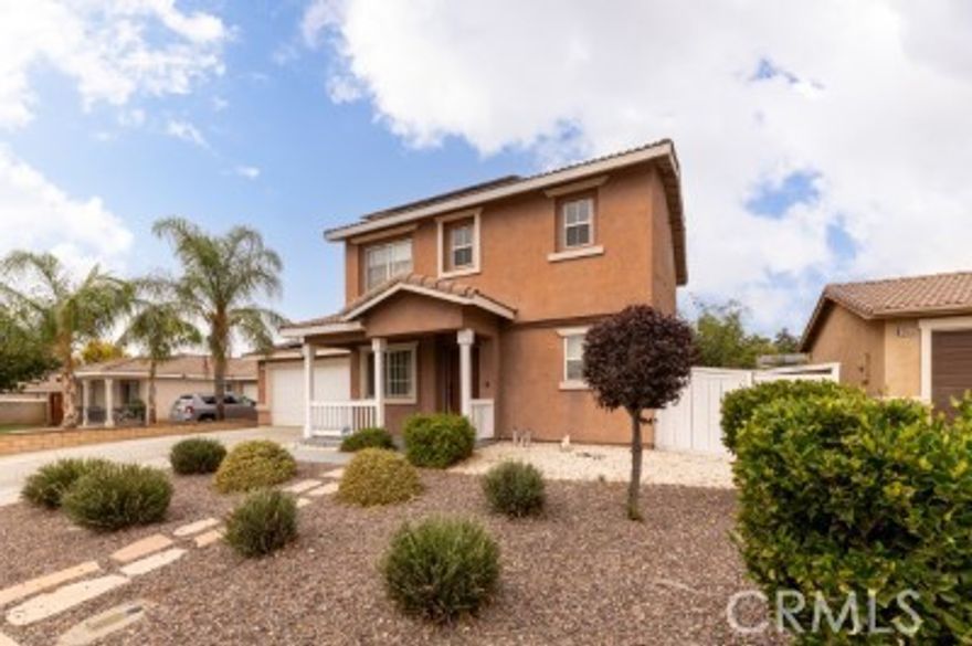 Welcome to 15475 Brasa Lane. Located in the desirable Moreno Valley Ranch community, this cozy 3-bedroom, 3-bathroom home offers a clean and bright atmosphere that will immediately make you feel at home. Situated on a spacious lot, this property features a large backyard with drought-tolerant landscaping, and a large concrete are perfect for family get togethers, BBQs & bonfires. As an added bonus the home comes with PAID SOLAR and two TESLA power walls significantly reducing electricity costs. Home is equipped with a NEMA plug to accommodate a Level 2 EV charger. Inside you'll find laminate wood flooring & tile throughout for easy cleaning and maintenance. Enjoy access to resort-style community amenities including pool, spa, and fitness center. The HOA also organizes fun activities throughout the year. Located near schools, shopping, hospital, and freeway access, this move-in ready home offers comfort, space, and convenience.