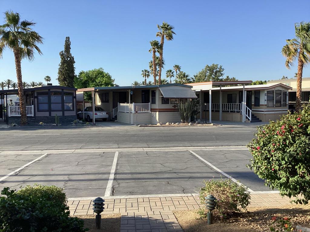 Highly sought after Seasonal Living Desert Shadows RV Resort. Own this beautiful one bedroom one bath, plus your own land in this gorgeous 55+ community. Amenities include indoor pool and spa/sauna, outdoor olympic size lap pool, 4 more pools, 3 more saunas throughout the Park. Eight pickle park courts, indoor shuffleboard, a 16,000 sq ft Community Building, PLUS SO MUCH MORE!
