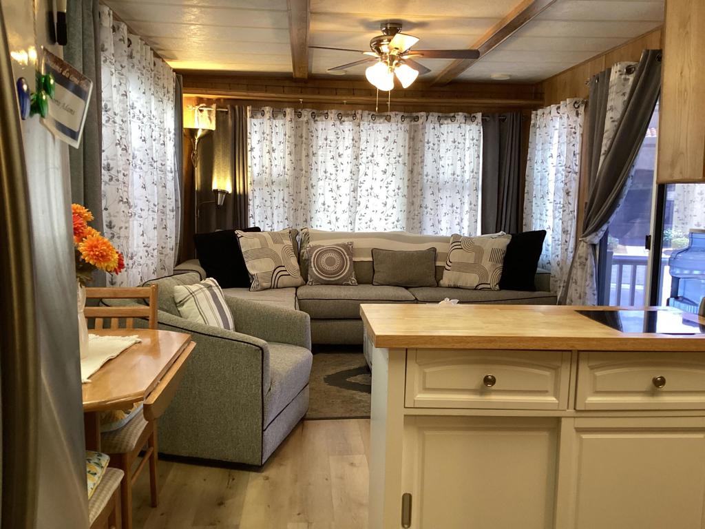 Highly sought after Seasonal Living Desert Shadows RV Resort. Own this beautiful one bedroom one bath, plus your own land in this gorgeous 55+ community. Amenities include indoor pool and spa/sauna, outdoor olympic size lap pool, 4 more pools, 3 more saunas throughout the Park. Eight pickle park courts, indoor shuffleboard, a 16,000 sq ft Community Building, PLUS SO MUCH MORE!
