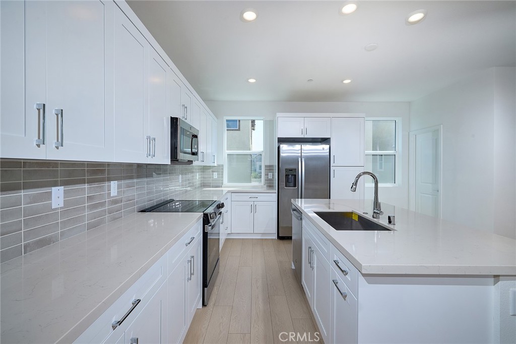 Price Drop – Now’s Your Chance! Move-in ready and designed for modern living, this stunning three-level detached home offers both style and functionality. The first floor welcomes you with a spacious two-car garage, a dedicated office or study space, and a cozy entryway. On the second floor, an open-concept layout features a contemporary kitchen with a large island and pantry, a generous dining area, and a bright great room that extends to a covered deck—perfect for indoor-outdoor living. Upstairs, the third floor boasts a serene primary suite with a walk-in closet and en-suite bath, two additional bedrooms with ample storage, a second full bath, and a convenient laundry area. Thoughtfully designed with elegant finishes, this home is move-in ready for you to enjoy today! Eastvale Square offers resort-style amenities designed for relaxation and recreation. Picture yourself lounging by the sparkling pool, unwinding in the soothing spa after a workout in the state-of-the-art fitness center, or enjoying quality time at the inviting clubhouse. Kids will love the vibrant playground, while adults can gather around BBQ grills and cozy firepits for unforgettable evenings. Stroll through scenic paseos, enjoy picnics in lush green spaces, or let your furry friends play in the dedicated dog park. For sports enthusiasts, a half basketball court adds to the fun. Experience the perfect blend of adventure and tranquility in this dynamic community.