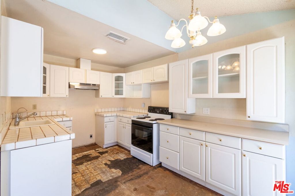 Great opportunity to own a two bedroom, one and a half bathroom condo in the desirable Newbury Hills community. The home offers 1,004 square feet of living space and is ready for your personal touch. Step through the private front patio into a spacious living area with the kitchen and guest bath conveniently located on the main level. Downstairs, the attached garage includes laundry hookups and generous storage space. Upstairs you will find two well-proportioned bedrooms, including one with a walk-in closet, along with a full bath. Just a few steps above, a bonus loft provides a cozy space for a home office, reading area, or creative retreat. The home also includes central heat and air for year-round comfort. Residents enjoy a beautifully maintained community with lush landscaping, a clubhouse, picnic garden, and a swimming pool that is heated seasonally from Memorial Day through September. There is plenty of street parking for guests. The location offers excellent convenience with easy access to the 101 Freeway, The Oaks Mall, Trader Joe's, Sprouts, and scenic hiking trails at Wildwood Regional Park. The property is located within the Conejo Valley Unified School District, including Newbury Park High School. Whether you are a first-time buyer or looking to downsize, this home offers a wonderful opportunity to own in a quiet and well-connected neighborhood.