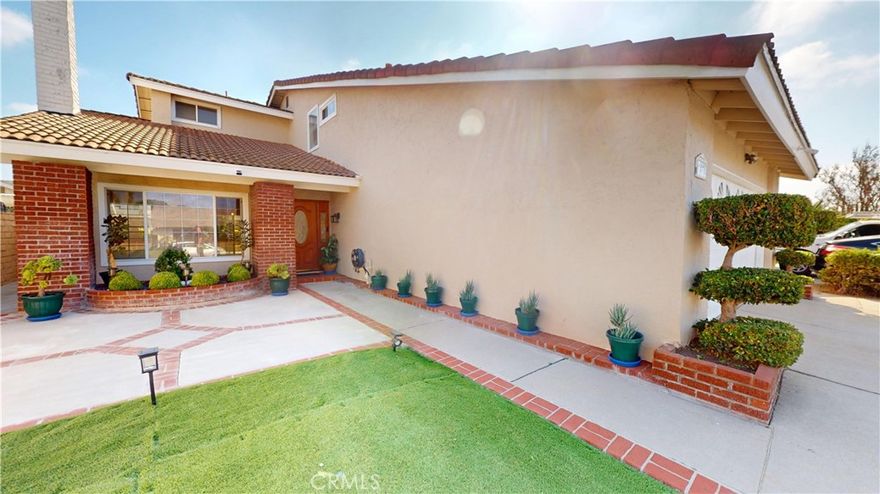 Welcome to this beautiful, quiet neighborhood nestled on a peaceful cul-de-sac. As you drive up, you'll notice the stylish turf artificial grass in the front yard, which not only enhances curb appeal but also conserves water. The backyard features a spacious slab patio accented with brick, perfect for outdoor entertainment.

The perimeter of the home is enclosed by an 8-inch block wall standing 5 feet in height, providing privacy and security. Inside, the first floor showcases elegant marble floors throughout. The two cozy fireplaces have been upgraded with marble tile and a new steel casement door, adding a touch of sophistication. There is a bedroom on the first floor with a full bathroom across the hallway, beautifully upgraded with full-height marble tiling and nice cabinets.

The family room and living room are bright and inviting, featuring new double-glazed sliding glass doors and windows, including a front window with a grid pattern, all of which have been replaced for enhanced energy efficiency. The kitchen features brand-new cabinets and gorgeous granite slab countertops, creating a perfect space for cooking and gatherings. Upstairs boasts three generously sized bedrooms, highlighted by a middle room with a walk-in closet, plus two full bathrooms for added comfort and convenience. The primary suite opens to a private balcony, perfect for quiet relaxation while taking in the mountain views.