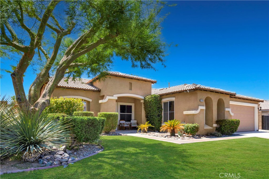This bright spot in the desert is 83281 Brighton Crest, where the interior shines just as beautifully as the sparkling backyard pool.
Step into this radiant Spanish-style home and you’ll find a generous open floor plan with abundant seating options, a bright, sun-soaked kitchen with stainless steel appliances, and a walk-in pantry and island.The kitchen is truly the heart of the home, serving as a central hub opening to both the living space and backyard. A sliding glass door from the living room creates a seamless connection to indoor/outdoor living and entertaining.
The backyard is thoughtfully landscaped around a gorgeous pool with a tanning shelf and an overflowing spa. A spacious covered patio, complete with a built-in grill and gas fire pit, offers the perfect setting to enjoy your yard both day and night—framed by breathtaking sunsets and mountain views.There’s also a dedicated parking space on the side of the home for your RV, trailer, or boat. No more paying for storage or offsite inconvenience.
Inside, the primary bedroom is a serene oasis featuring a large ensuite bathroom, dual sinks, walk in closet, and sliding glass doors directly to your backyard retreat. Two additional bedrooms, a full bathroom, and a direct-access two-car garage complete the home’s layout.
The north Indio location in a gated community is in short distance to tons of shopping, eateries and conveniences, as well as freeway access.
This is truly a special property, ready for its next owner. Come take a look—you just might find it’s the bright spot in your future.
