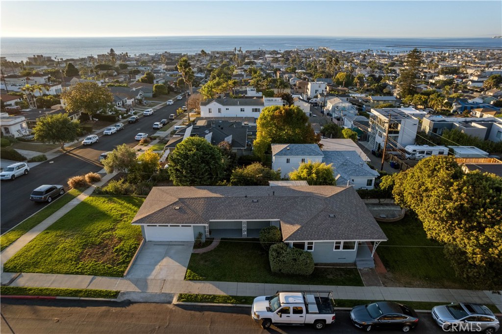 Located on the border of Ocean Beach and Point Loma with ocean views from both ends of the property! 1712 Froude Street offers the perfect blend of classic coastal charm and modern comfort. This single-story ranch-style home, originally built in the 1960s, has been thoughtfully remodeled throughout and is ready for its next owner. The home features three spacious bedrooms, two beautifully renovated bathrooms, and an attached two-car garage with laundry hookups. Inside, the open and inviting floor plan includes all-new laminate wood flooring, fresh interior and exterior paint, and new dual-pane windows that fill the home with natural light.
The kitchen has been completely updated with new shaker-style cabinetry, quartz countertops, a stylish tile backsplash, and stainless-steel appliances including a range, dishwasher, and refrigerator. Both bathrooms have been fully remodeled as well, showcasing new vanities, tile wainscoting, and updated fixtures. Just off the main living area, a private rear deck and sitting area provide an ideal space for outdoor relaxation, entertaining, or enjoying a quiet evening by a firepit.
Beyond being a move-in-ready residence, this property offers exceptional development potential. Situated on a corner lot with alley access, the site is zoned RM-1-1, allowing for multiple dwellings and the possibility of adding accessory dwelling units or potentially split the lot and build even more. Many neighboring owners have recently taken advantage of this zoning to build two- and three-story properties that capture breathtaking ocean views. Limited ocean views are already visible from the property, and expanding upward could unlock truly spectacular vistas.
Included in the sale are architectural and engineering plans designed to retain the existing home and add four additional units, creating a total of five units and 4,662 square feet on the lot. These plans can be provided to the buyer upon request, making this a unique opportunity for both homeowners and investors.
Positioned in one of San Diego’s most desirable coastal neighborhoods, this home offers easy access to the beach, Liberty Station, and a variety of local restaurants, coffee shops, and parks. Whether you’re looking for a stylish turnkey home or a property with outstanding development potential, 1712 Froude Street represents an exceptional opportunity in a prime location.