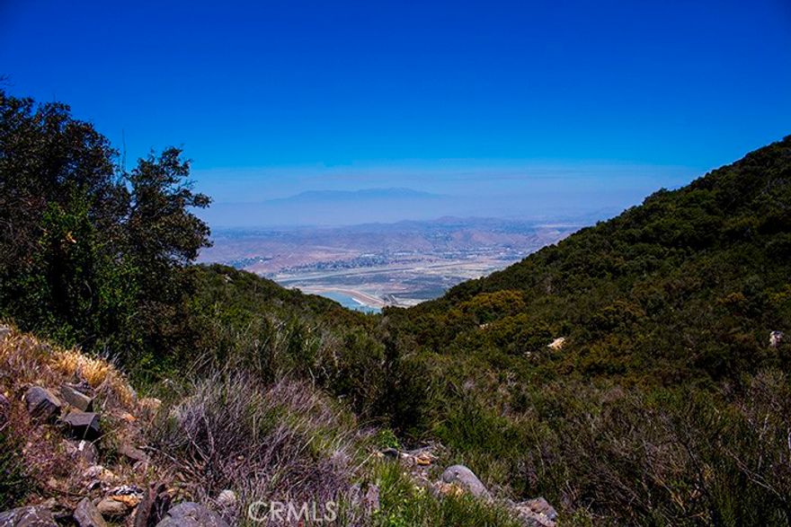 HERE'S YOUR CHANCE TO BUILD YOUR LITTLE SLICE OF HEAVEN on this BEAUTIFUL PANORAMIC VIEW LOT high above Lake Elsinore in the historic equestrian community of Rancho Capistrano! Just 5 scenic miles off of Ortega Hwy (HWY 74), in Cleveland National Forest, this community is perfect for Equestrians, Commuting executives, Growing families, or a Stunning Weekend Retreat! This lot is 2.55 acres, is ready to build, just outside the main gate entrance. A 2000-gallon septic tank and water meter are already on site. Seller already has some initial planning completed. Renderings available. Riding trails, hiking trails, and wildlife abound within and around the naturally beautiful community. Association amenities include a Clubhouse, Tennis courts, newly paved "horse friendly" streets throughout the gated area. Community gatherings and neighborly actions are "the norm" here. Close to I-15, lake access, shopping and schools and only 30 minutes from San Juan Capistrano, this lot is not to be missed!