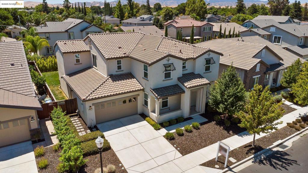 Welcome to this expansive 5-bedroom, 4-bathroom home built in 2016, thoughtfully designed to meet the needs of today’s modern lifestyle. Situated on a spacious 7,000+ sq ft lot, this property features a 3-car garage, an upstairs loft, and a convenient junior suite. A full bedroom and bathroom on the main level offer ideal accommodations for guests or multigenerational living. The flexible floor plan includes a dedicated office space off the kitchen and a dining area that opens to a private patio, perfect for entertaining or quiet evenings at home. Nestled in a peaceful, newer Brentwood neighborhood, you’ll enjoy close proximity to local schools, shopping, and dining, as well as Brentwood’s Aquatic Center and Veterans Park. With Downtown Brentwood and Highway 4 just minutes away, this home offers the perfect blend of comfort, convenience, and connection. Buyer to verify home and lot size.