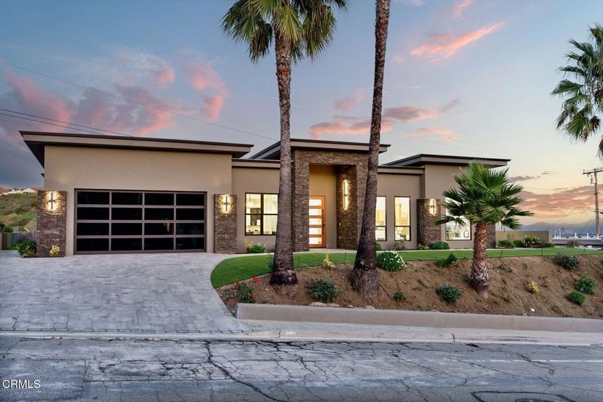 Experience modern coastal living at its finest in this brand-new 2,454 sq ft home in Ventura's coveted Ondulando neighborhood. Offering 4 bedrooms and 3.5 bathrooms, this estate is designed for modern living and effortless entertaining. Milgard floor-to-ceiling windows and Western Window Systems doors in the kitchen and primary suite flood the home with light. They frame Ventura's sweeping ocean and island views as well as Ojai's iconic 'pink moment' sunsets. The heart of the home features a stunning open living space, where engineered hardwood floors and quartzite surfaces add warmth and elegance. The chef's kitchen is a true showpiece, equipped with a Sub-Zero refrigerator, Wolf range and hood, and Cove dishwasher, blending style with top-of-the-line functionality. Step outside to enjoy the exclusive amenities of the Ondulando Club or entertain on your outdoor patio, taking in serene coastal views. Fully owned solar ensures energy efficiency without compromising comfort. Every detail has been thoughtfully designed to balance indoor and outdoor living, creating spaces that flow seamlessly. The four spacious bedrooms and three luxurious bathrooms offer privacy and retreat, while open living areas provide the perfect backdrop for family gatherings and entertaining friends. Never before lived in, this home offers a rare opportunity to enjoy brand-new luxury, ocean vistas, and Ventura's serene lifestyle--all in one exceptional address.