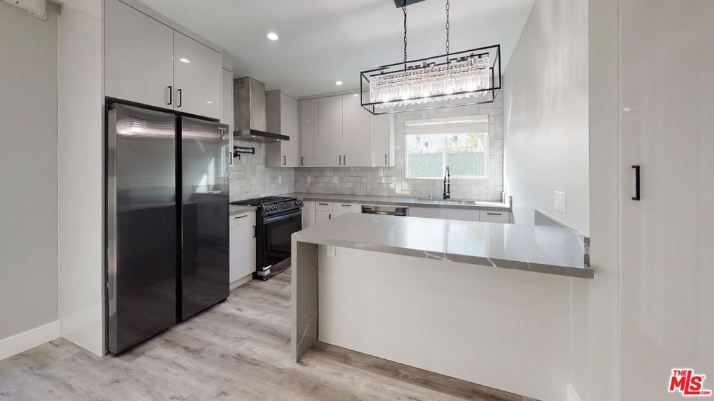 Welcome to your dream home in the heart of Mid City Heights, Los Angeles! This stunning, newly renovated 1-bedroom apartment showcases high-end finishes and a modern design that perfectly blends elegance, comfort, and functionality. Step inside to an inviting, light-filled living space featuring brand-new stainless steel appliances, including a counter-depth refrigerator that maximizes both space and style. The amazing kitchen island serves as the focal point ideal for meal prep, casual dining, or entertaining guests. With sleek cabinetry, modern hardware, and an open layout, the kitchen offers a perfect balance of luxury and practicality. The bathroom has been completely upgraded, featuring LED lighting and a luxurious dual-shower setup with two shower heads creating a spa-like retreat designed for total relaxation and comfort. Every detail has been carefully chosen to elevate your lifestyle, from the premium finishes to the bright, airy flow throughout the apartment. This home also includes convenient parking and water, making your living experience even more effortless. Nestled in a prime Mid City Heights location, you'll be just minutes from The Grove, LACMA, Beverly Hills, and some of Los Angeles' most popular restaurants, cafes, and boutiques. Enjoy the best of both worlds the vibrancy of city life paired with the tranquility of a charming residential neighborhood.Don't miss the chance to make this beautiful Mid City Heights apartment your new home. With its luxury upgrades, designer features, and unbeatable location, this is modern Los Angeles living at its finest.
